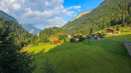 Tranquil landscape of the valley in Swiss alps  with some traditional buildings