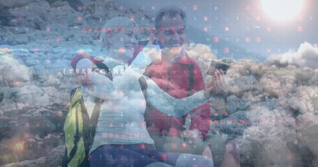 Smiling hiking couple holding smartphone with yellow and gray backpacks on rocky hill, code overlay