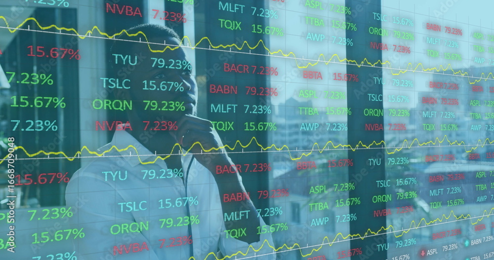 Poster man in suit analyzing stock data behind transparent screen in office, with yellow line graphs
