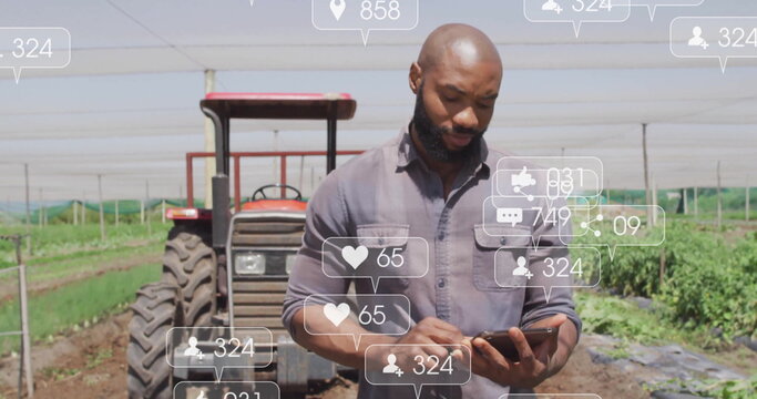 Checking farmer using tablet in shade-netted farm field, with red tractor and social media icons