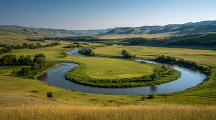 Curved river winds through a valley landscape under a bright, blue sky