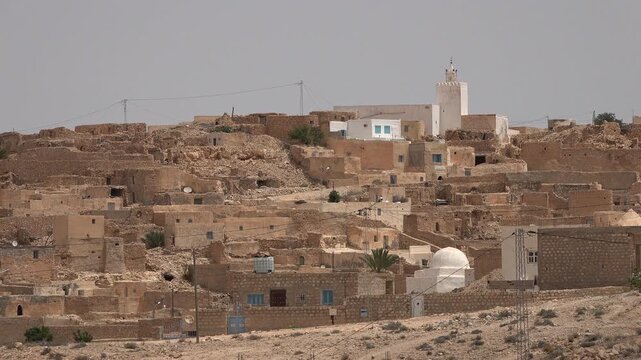 Small mosque on hilltop of Tamezret, a traditional Berber town with troglodyte houses in Tunisia

