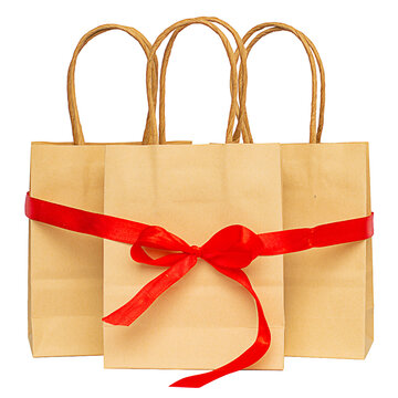 Crane bags tied with red senta with bowknot on white background, discount and shopping concept