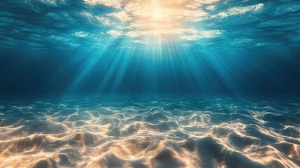 Fototapeta premium Sunlight beams through the turquoise water, illuminating the sandy ocean floor.