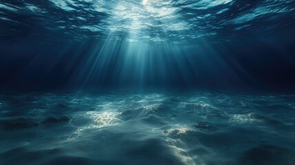 Submerged depths, showcasing sunbeams penetrating the water, illuminating the ocean floor.