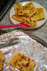 Serving freshly baked garlic bread for lunch