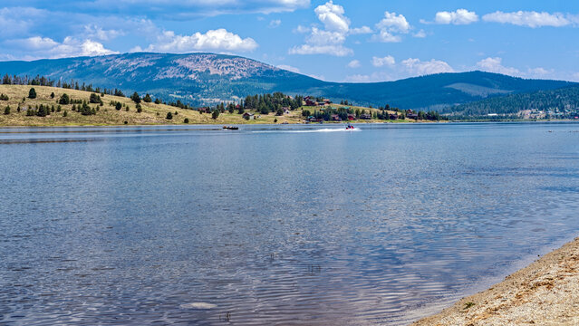Boaters on Georgetown Lake west of Anaconda, Montana, USA - Powered by Adobe