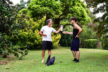Father and son enjoying a sunny day in the garden together