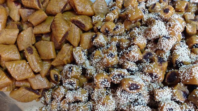 Close-up of traditional sweet cookies called 'makroud' in bakery inside old city center (medina) in Tunis
