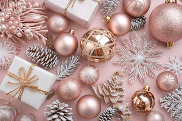 Rose gold Christmas ornaments gifts and decorations on pink background