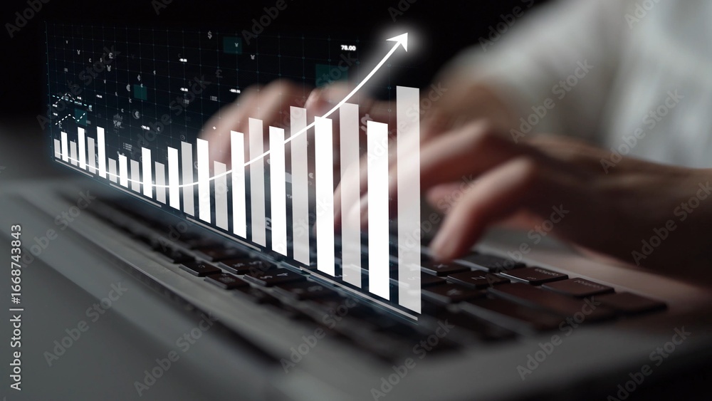 Aufkleber close-up of hands typing on a laptop keyboard with a digital graph overlay, representing business gr