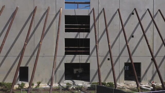 Precast concrete wall panels building construction with steel support columns.
