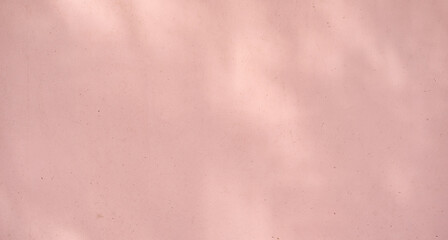 Abstract minimal peach background with subtle textured surface and soft lighting.