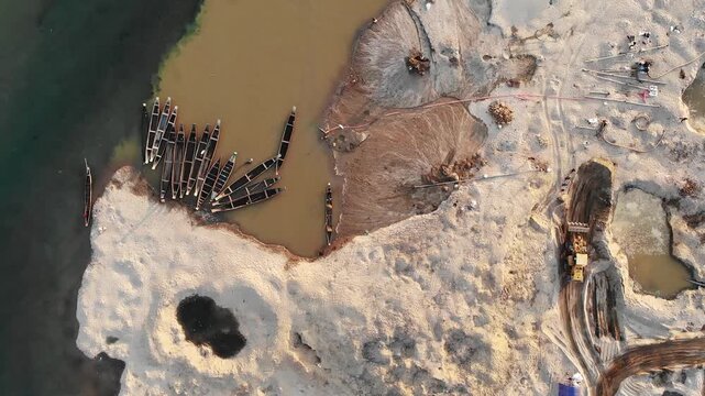 Jaflong, Bangladesh - 21 August 2025: Aerial view of boats resting near the shore where the land meets the water, showcasing the textures and landscape.