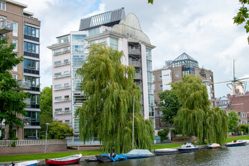 A cityscape view of buildings along the canals of the city Amsterdam, Netherlands.