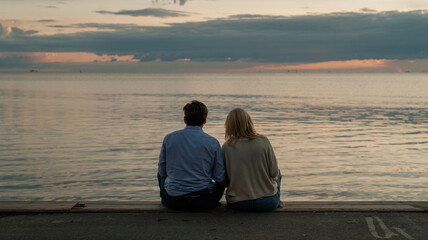 Couple enjoys silence by the water