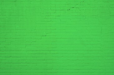 Grüne Backsteinwand als rustikaler Hintergrund
