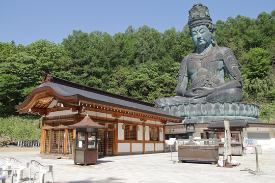 statue of buddha in a buddhist temple (showa daibutsu buddha) in aomori in japan 