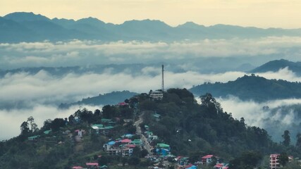 Sajek, Bangladesh - 21 August 2025: Aerial view of the settlements nestled among rolling green hills, a tranquil vista of nature and human habitation.