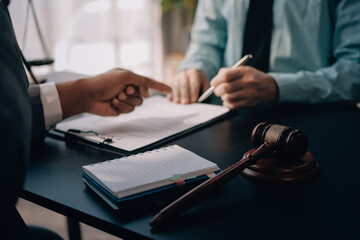 Lawyer explained to the client about the law that must be brought against the court case.