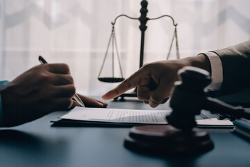 Lawyer explained to the client about the law that must be brought against the court case.