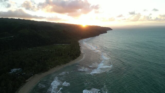 Aerial footage of Playa Cos&oacute;n sunset &mdash; palm silhouettes, sandy shore, and calm sea in warm light. Great for cinematic B-roll
