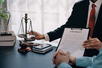 Lawyer explained to the client about the law that must be brought against the court case.
