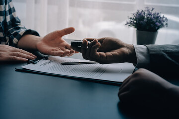 Car salesman gave the keys to the customers who signed the purchase contract legally, Successful...
