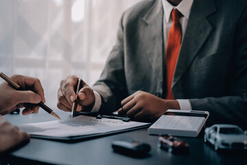 Car salesman gave the keys to the customers who signed the purchase contract legally, Successful...
