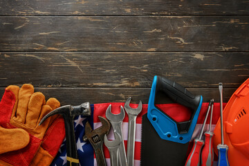 Happy Labor Day. Construction tools hammer, wrench, screwdriver, pliers, construction helmet on...