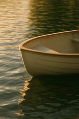 Obraz premium Tranquil sunset reflecting off a wooden rowboat on calm waters