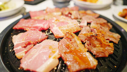 Korean cuisine, grilling pork barbecue traditional style in a restaurant, selective focus. AI