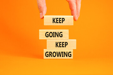 Keep going and growing symbol. Concept words phrase Keep going keep growing on beautiful wooden...