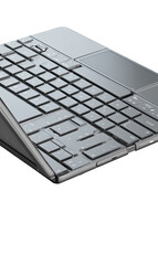 Gray laptop keyboard and trackpad angled view