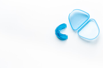 Orthodontic appliance for correction of teeth with a box on white background. Dental mouth guard