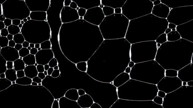 Texture of white soap foam with bubbles abstract background. Soap sud macro structure. Bathtup Soap Foam. Natural White Shampoo Bubbles Motion. High quality 4k footage