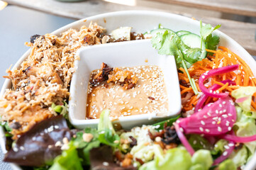 Fusion dish with raw vegetables and pulled turkey in  Virton, Province de Luxembourg, Belgium
