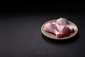 Raw chicken or turkey legs as a food background for cooking on a barbecue or grill. Chicken raw legs