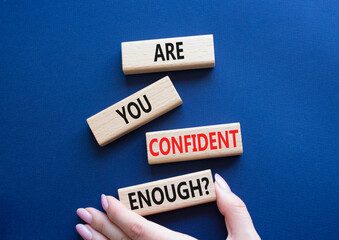 Confidence symbol. Wooden blocks with words Are you confident enough. Businessman hand. Beautiful...