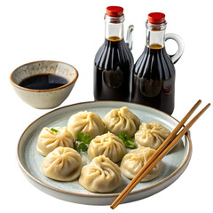 A plate of dumplings with soy sauce isolated on a transparent background