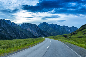 Road among picturesque mountain peaks