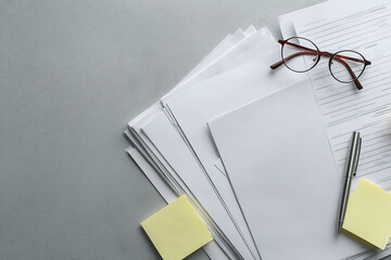 Stacked papers and notes reflect financial crisis review, crisis materials presented with clarity, crisis imagery fits media on economy or law