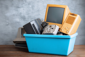 Electronic waste disposal, old electronics are placed in a special container, responsible waste management and technology