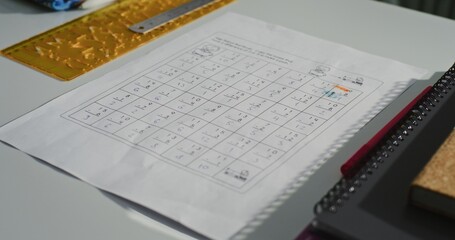 Close Up of School Desk with Student School Supplies, Notebooks, Paper with Mathematical Problems. Math Class in Modern Primary School Classroom, Creative Space for Children Studying and Education.