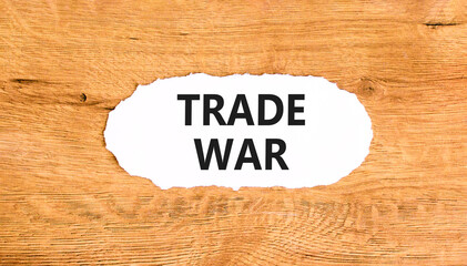 Trade war symbol. Concept word Trade war on beautiful white paper. Beautiful wooden paper...