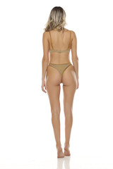 Rear back view of blonde woman in golden lingerie standing barefoot on tiptoes. Studio shot on white background.