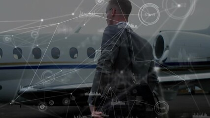 Businessman striding across tarmac toward jet, activating digital overlays visualizing connectivity - Powered by Adobe