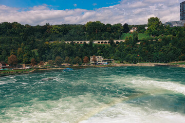 Majestic view of Rhine Falls, the largest waterfall in Europe, located near Schaffhausen in...