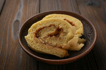 Freshly Baked Swiss Roll Cake on Rustic Wooden Table