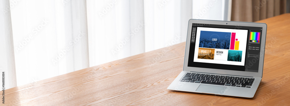 Poster graphic designer software for modern design of web page and commercial ads showing on the computer s
